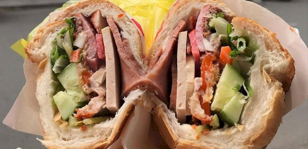Banh mi 59 is known for its unique blend of meats, including cold cuts, grilled pork, and pâté 